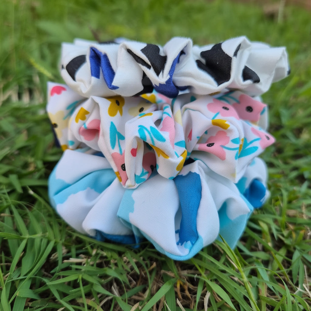 Collection of colorful scrunchies on grass